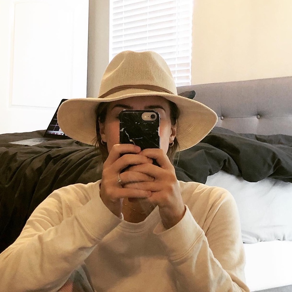 beige anthropologie hat with brown belt